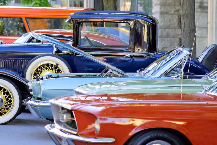 classic cars lined up on display outside 