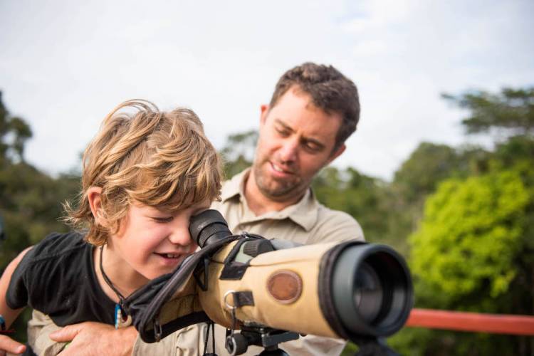 kid looking through nature view finder at a state park