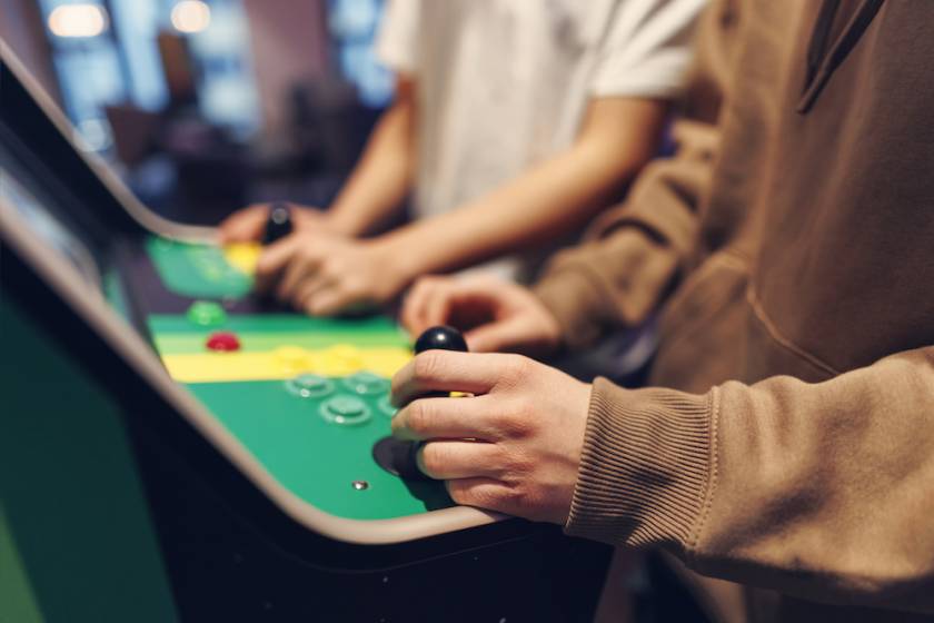 people playing at an arcade