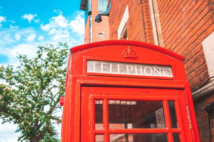 top of a red phone booth