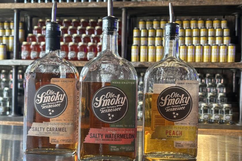 Three bottles of Ole Smoky Whiskey on a bar